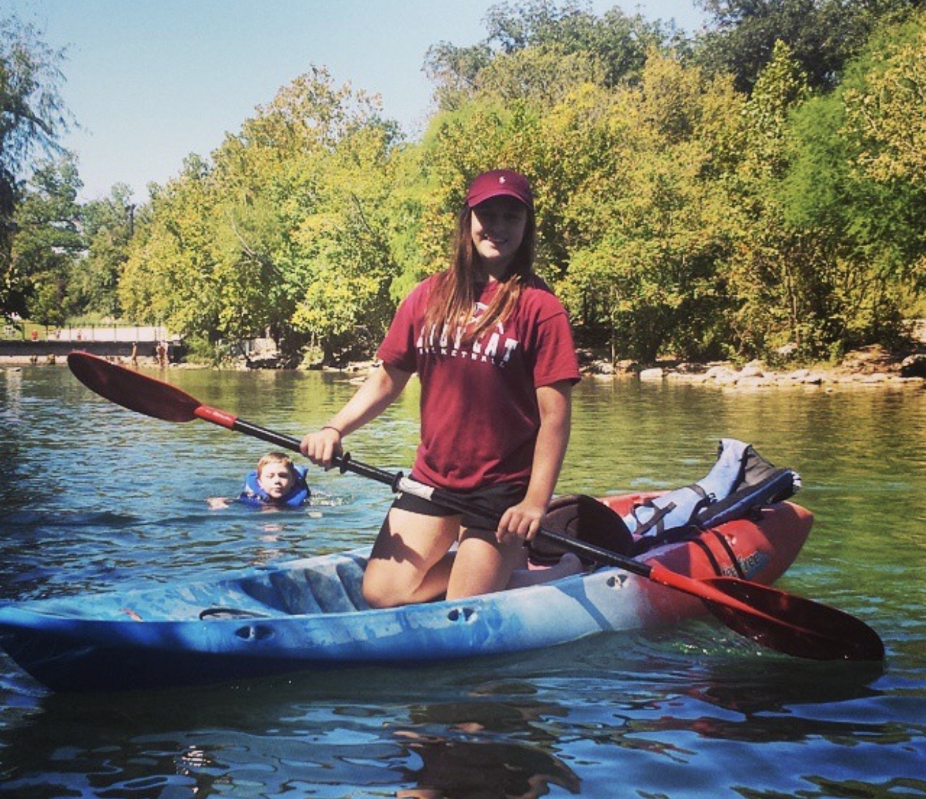 Gracey kayaking on a lake